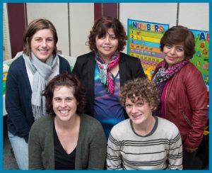 A group of women pose for a picture.