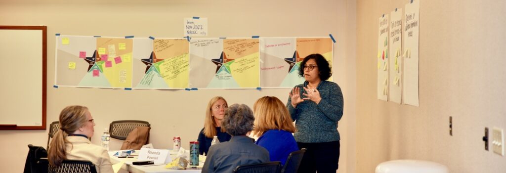 Claudia Gonzalez- George pictured sharing group insights at an NREEC Meeting.