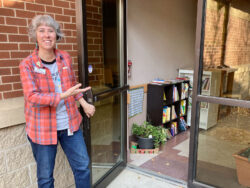 Library Director, Natalie Draper, invites readers to the new library oasis location in the NCRC