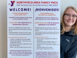 Izzy Hessian, AmeriCorps Promise Fellow at the YMCA displays homework help options for kids.